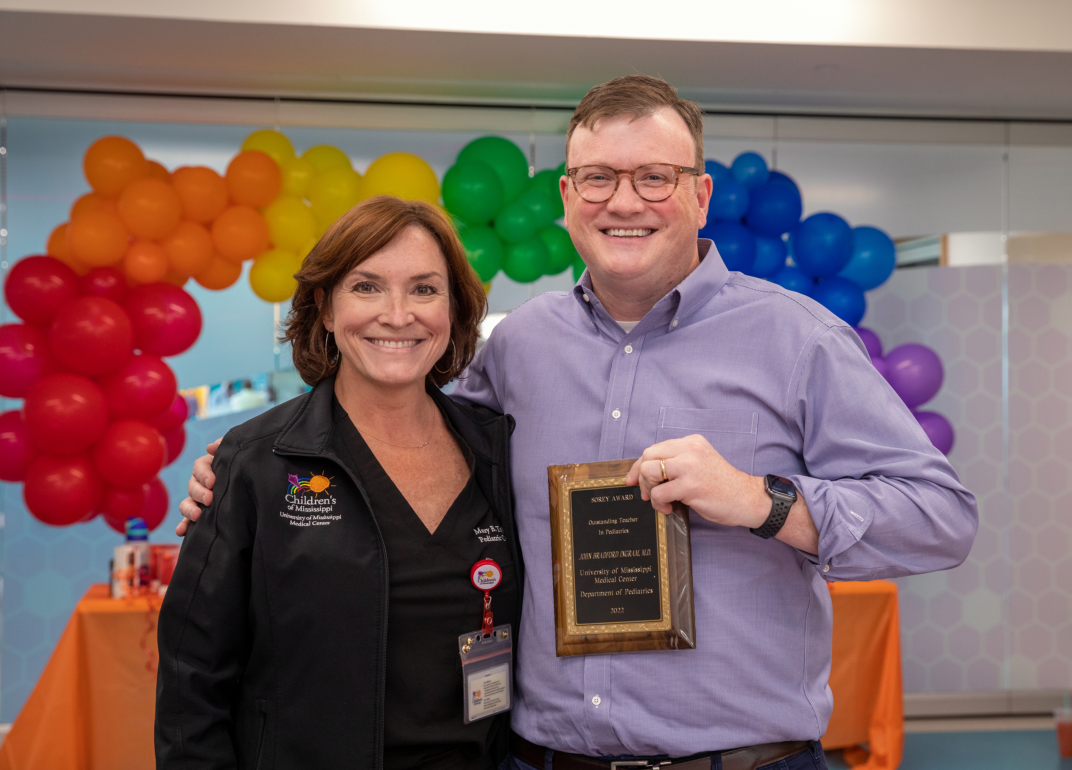 Dr. Mary Taylor, Suzan B. Thames Chair and professor of pediatrics, congratulates Dr. Brad Ingram on winning the Sorey Award for Outstanding Faculty Teacher during the Department of Pediatrics annual Awards Day.